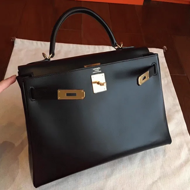 Reference image illustrating Replica Hermes Kelly Retourne 32cm Black Box Leather Handbag – Timeless Icon