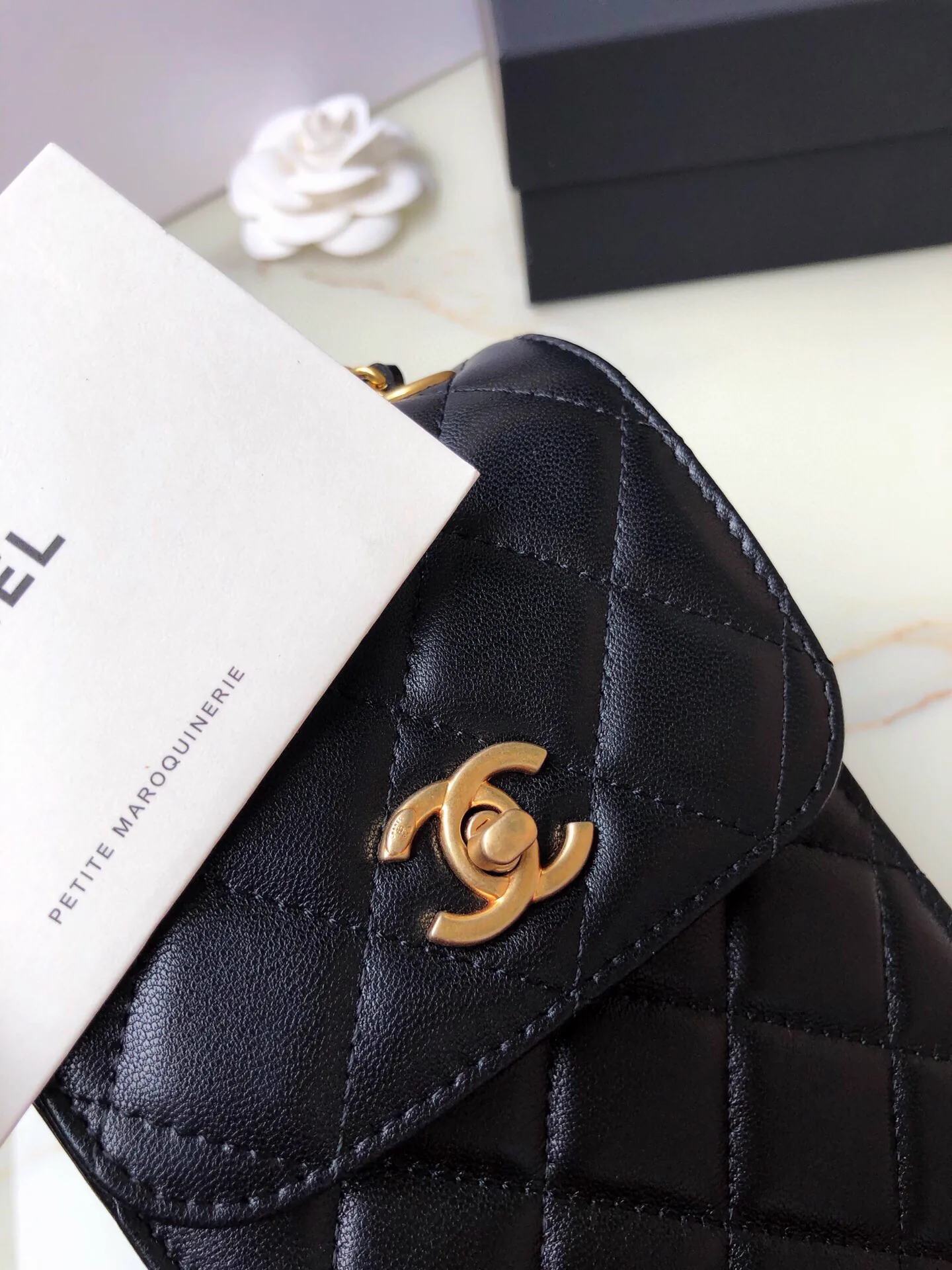Reference image illustrating Replica Chanel Classic Flap Clutch Bag in Quilted Lambskin with Gold-Tone Hardware