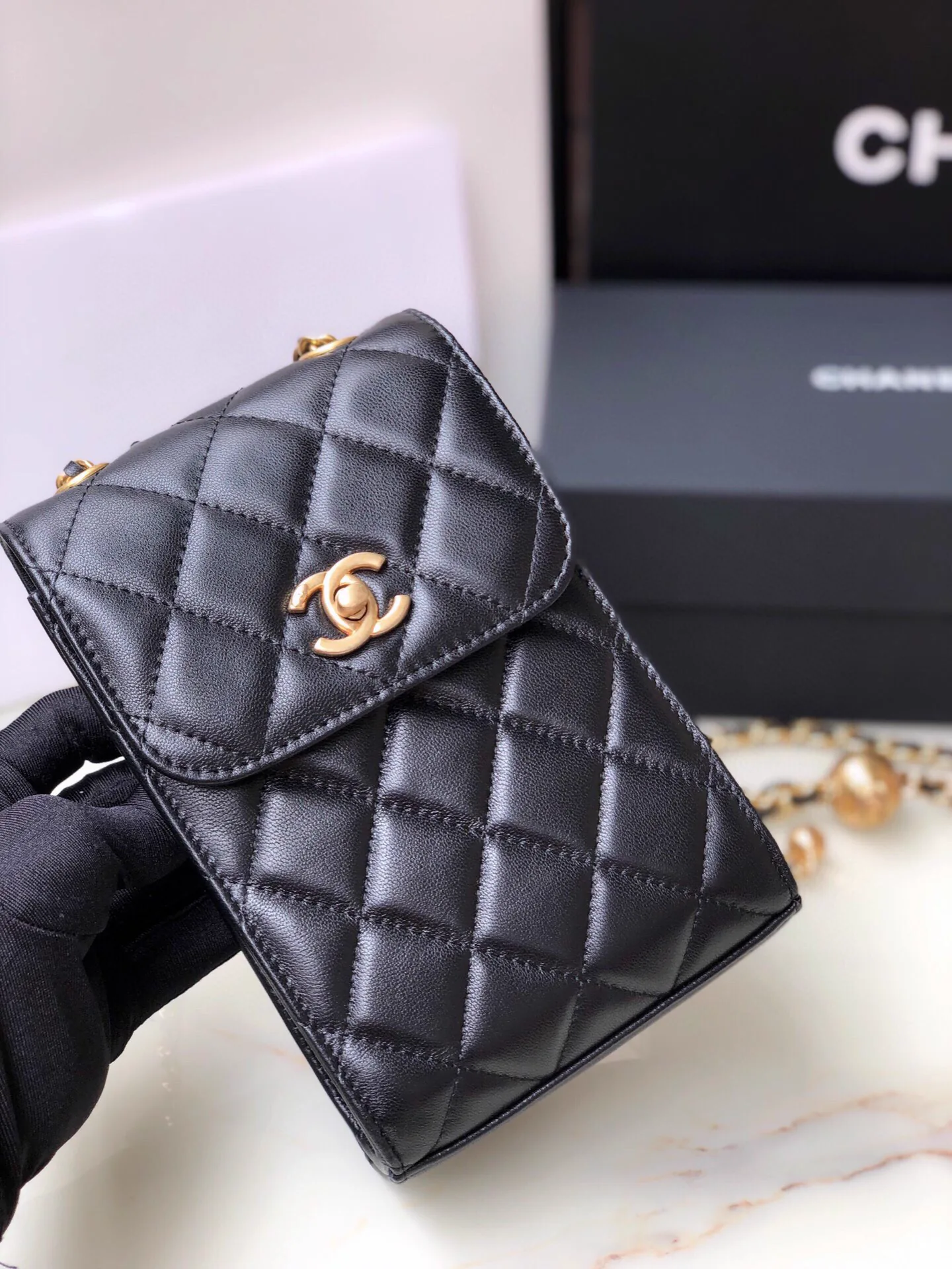 Reference image illustrating Replica Chanel Classic Flap Clutch Bag in Quilted Lambskin with Gold-Tone Hardware