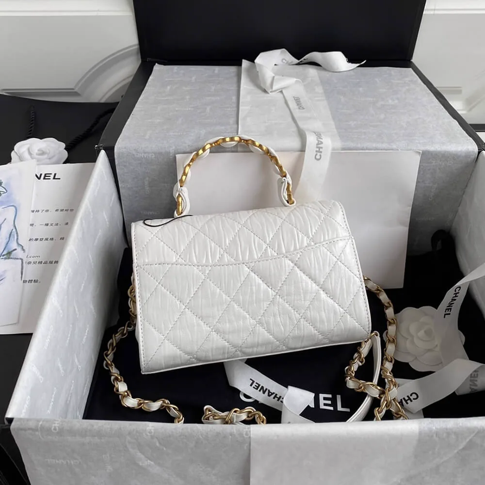 Reference image illustrating Replica CHANEL Mini Flap Bag with Top Handle – A Detailed Style Guide