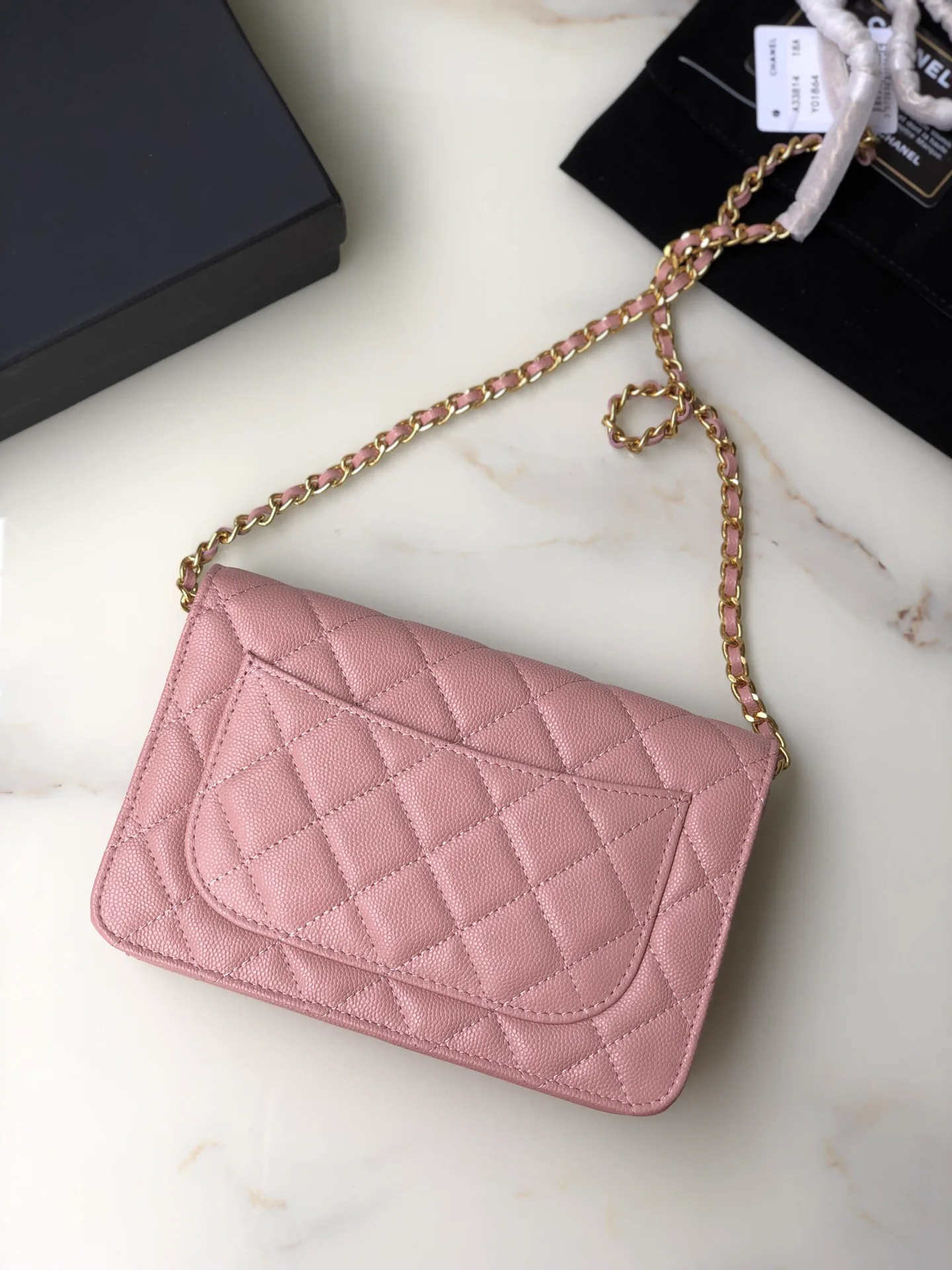 Reference image illustrating Replica Chanel Classic Flap Wallet on Chain (WOC) in Caviar Leather with Gold Hardware