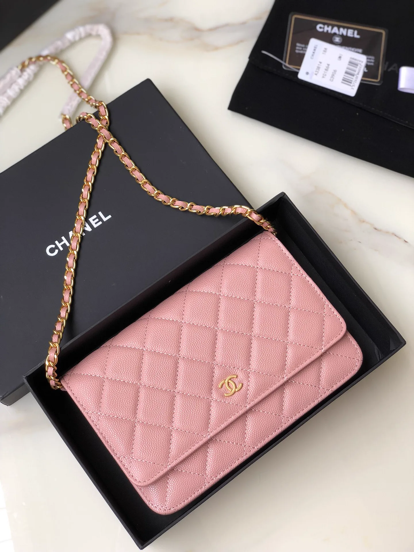 Reference image illustrating Replica Chanel Classic Flap Wallet on Chain (WOC) in Caviar Leather with Gold Hardware