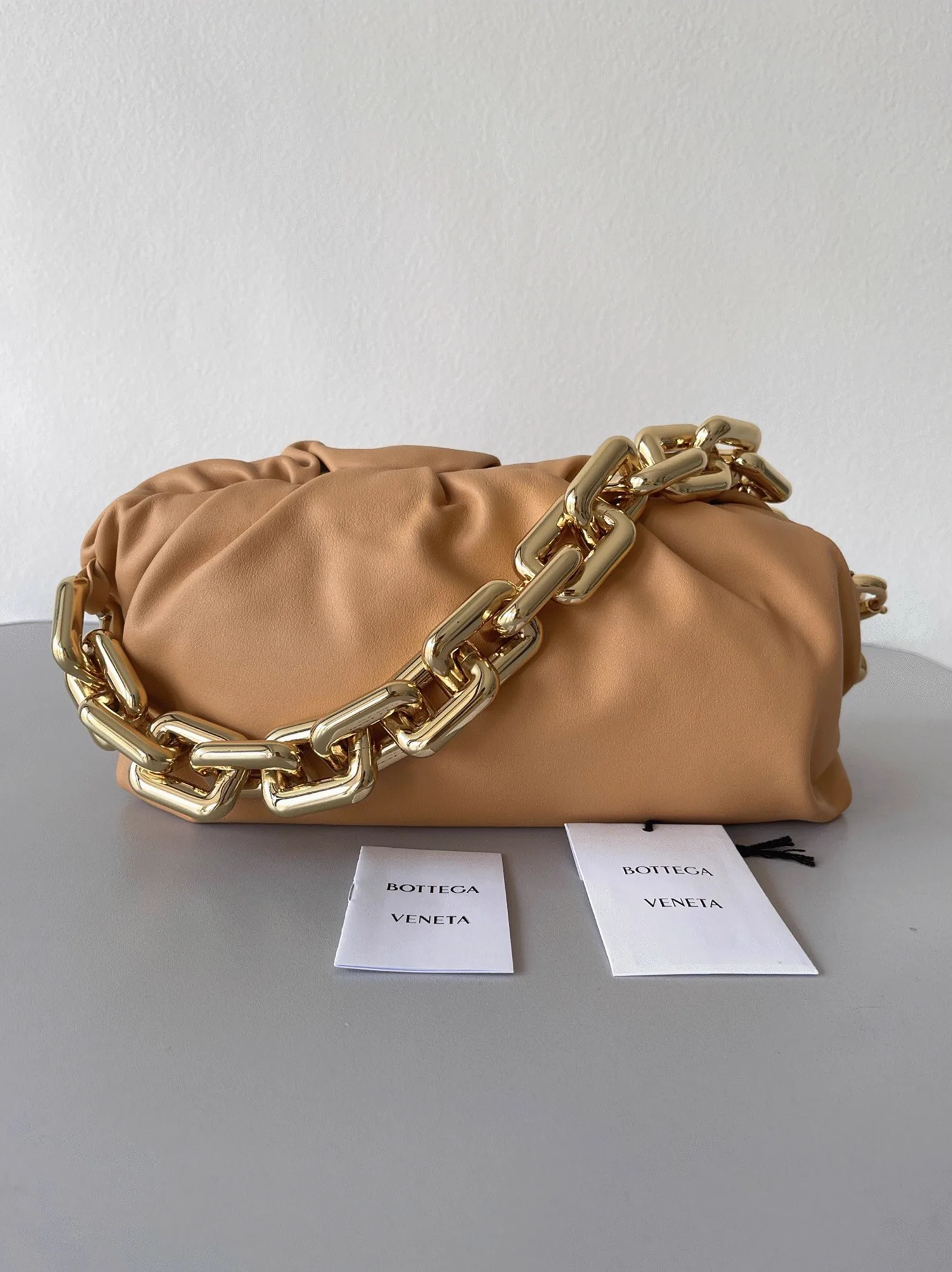 Reference image illustrating Replica Bottega Veneta The Chain Pouch Bag in Almond – Style, Design & How to Wear It