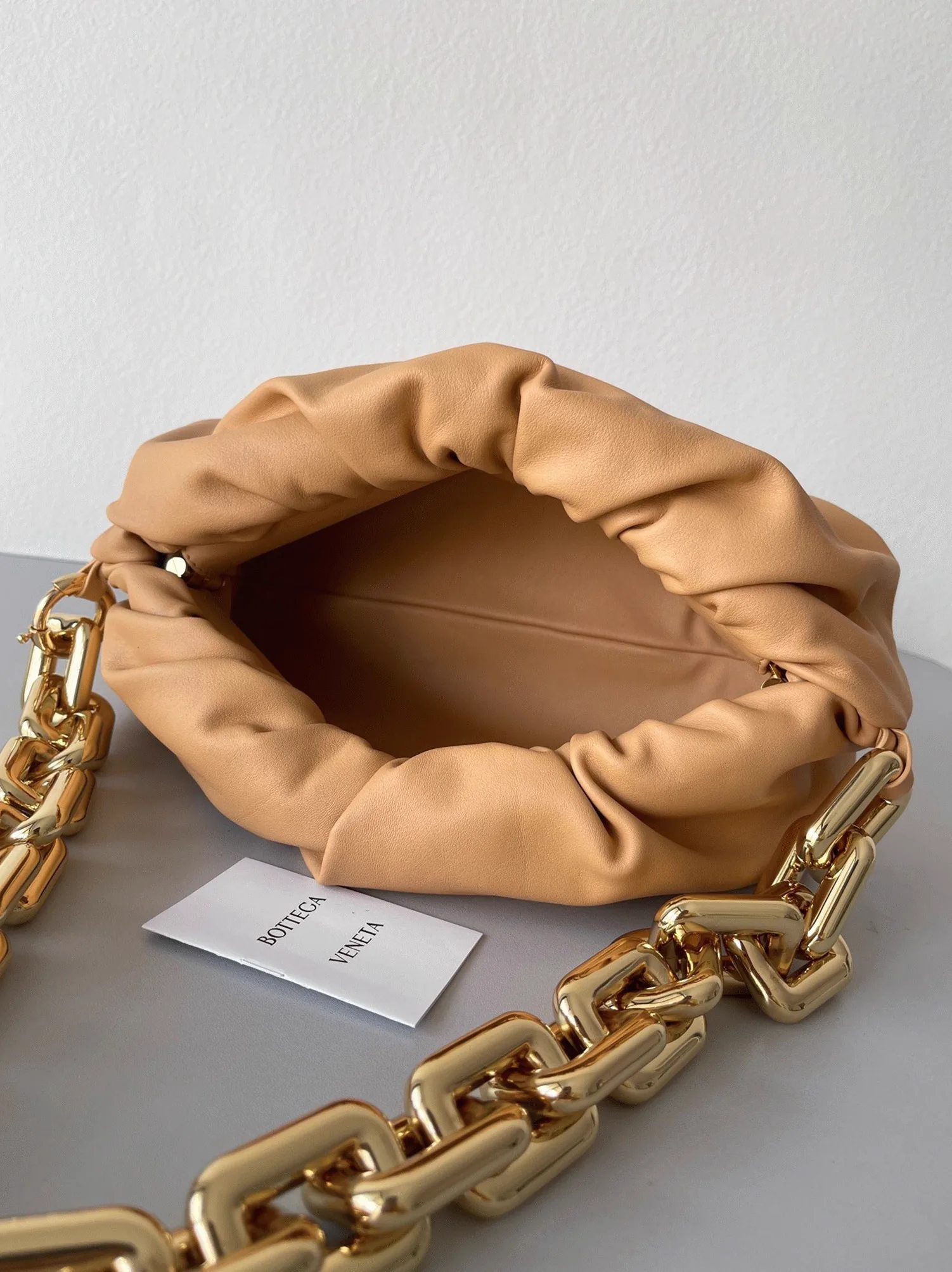Reference image illustrating Replica Bottega Veneta The Chain Pouch Bag in Almond – Style, Design & How to Wear It