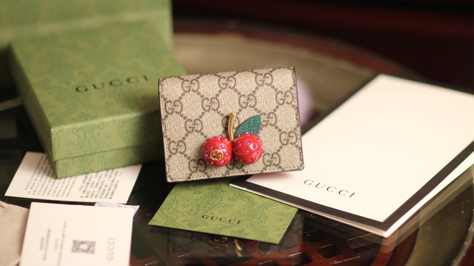 Reference image illustrating Replica Gucci Cherry Wallet: A Detailed Look at the Playful Icon