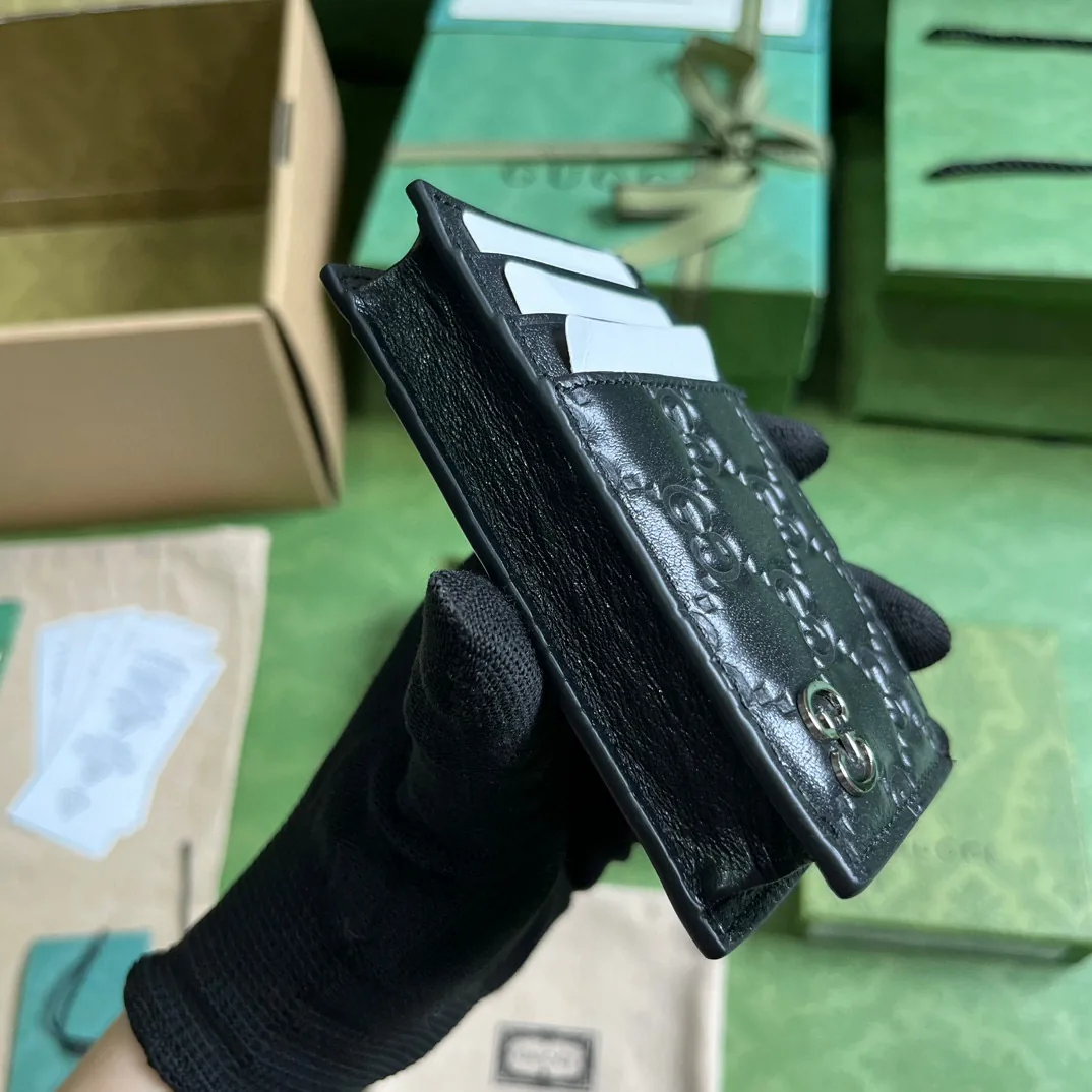 Reference image illustrating Replica Gucci Bi-Fold Wallet in GG Supreme Canvas and Leather