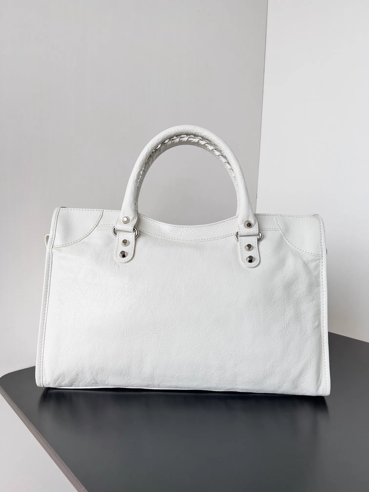 Reference image illustrating Replica Balenciaga Le City Medium Bag in White Arena Lambskin – A Detailed Style Guide