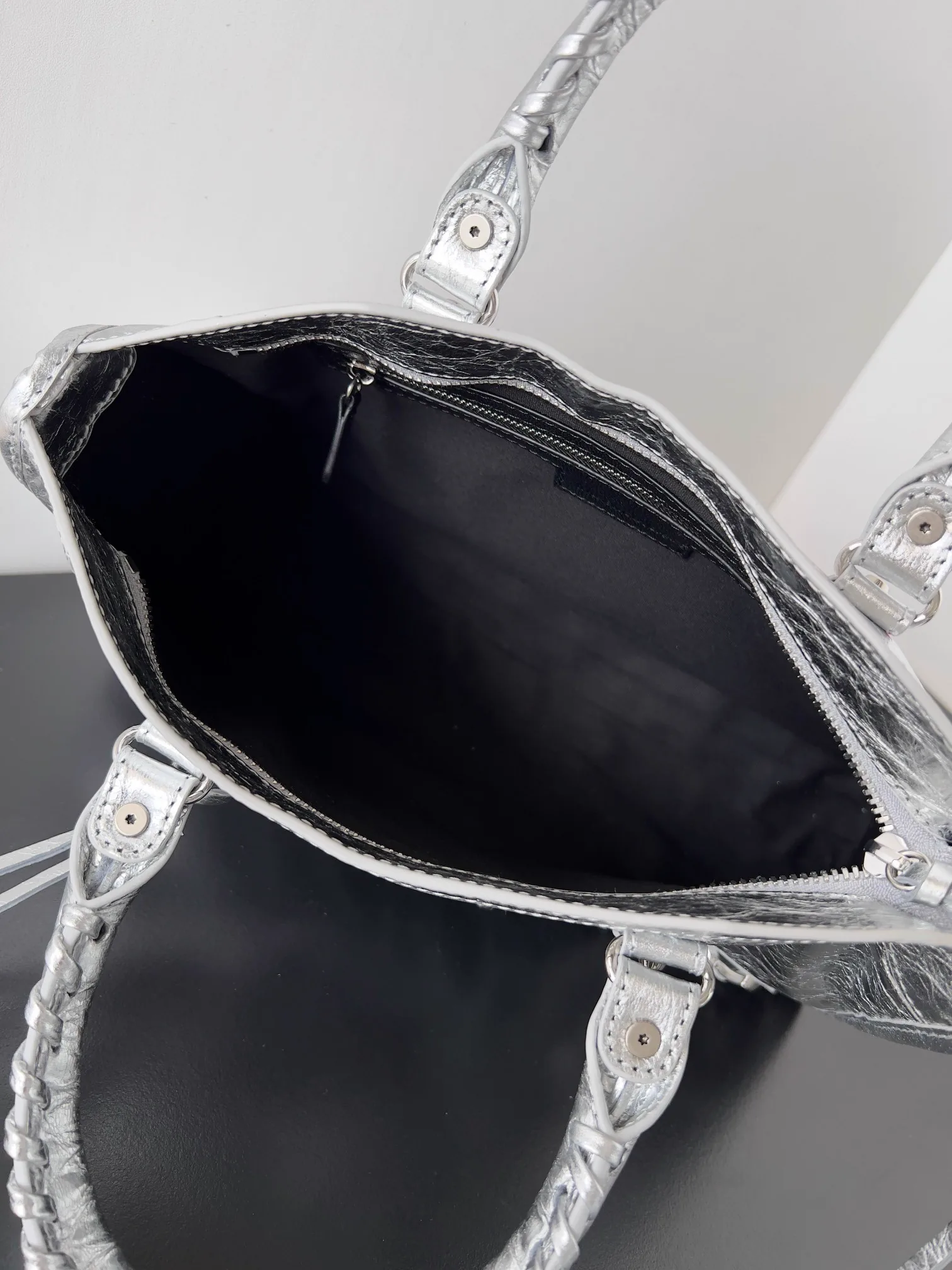 Reference image illustrating Replica Balenciaga Le City Small Bag Silver Metallic Lambskin – A Detailed Style Guide