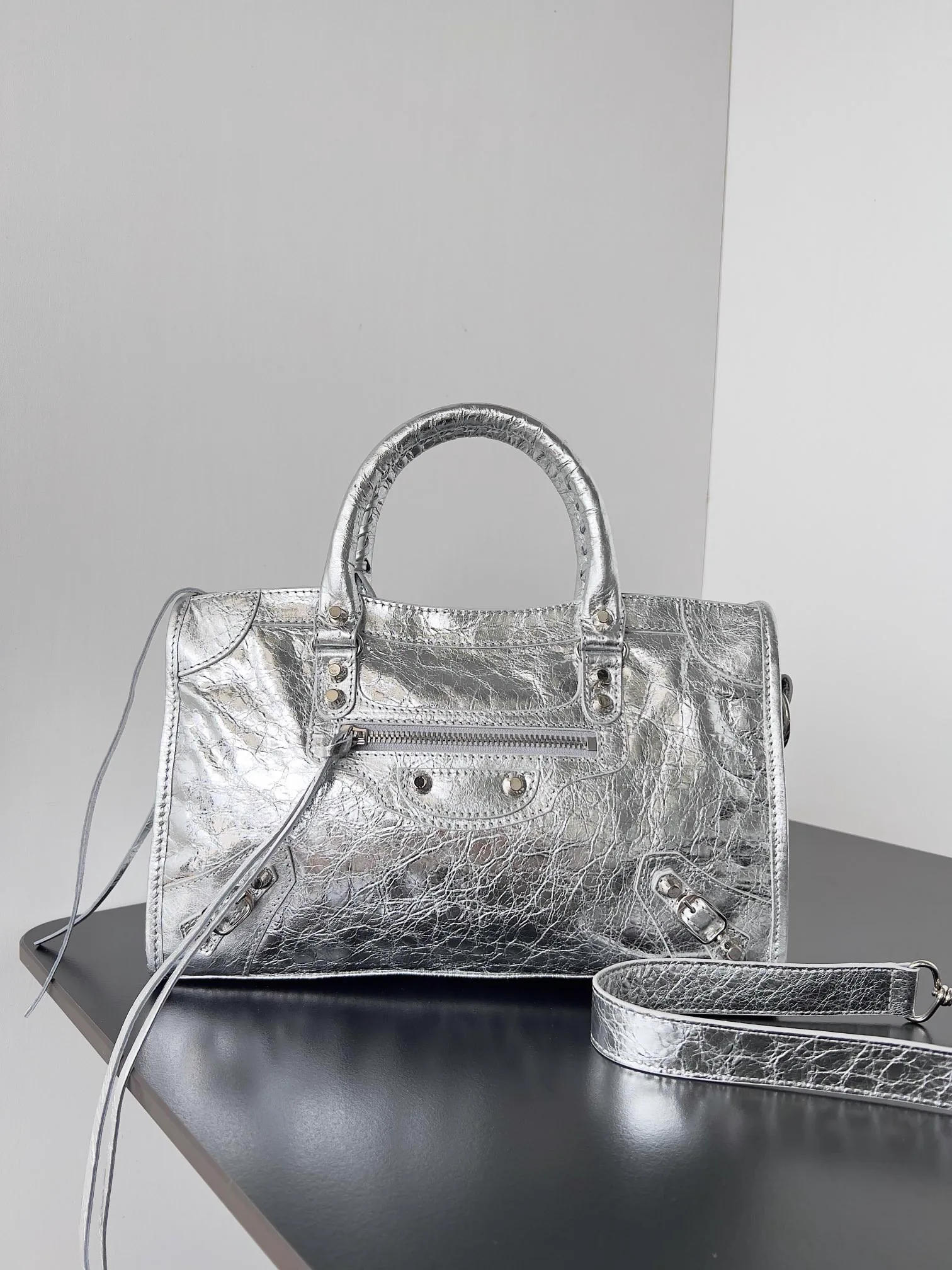 Reference image illustrating Replica Balenciaga Le City Small Bag Silver Metallic Lambskin – A Detailed Style Guide