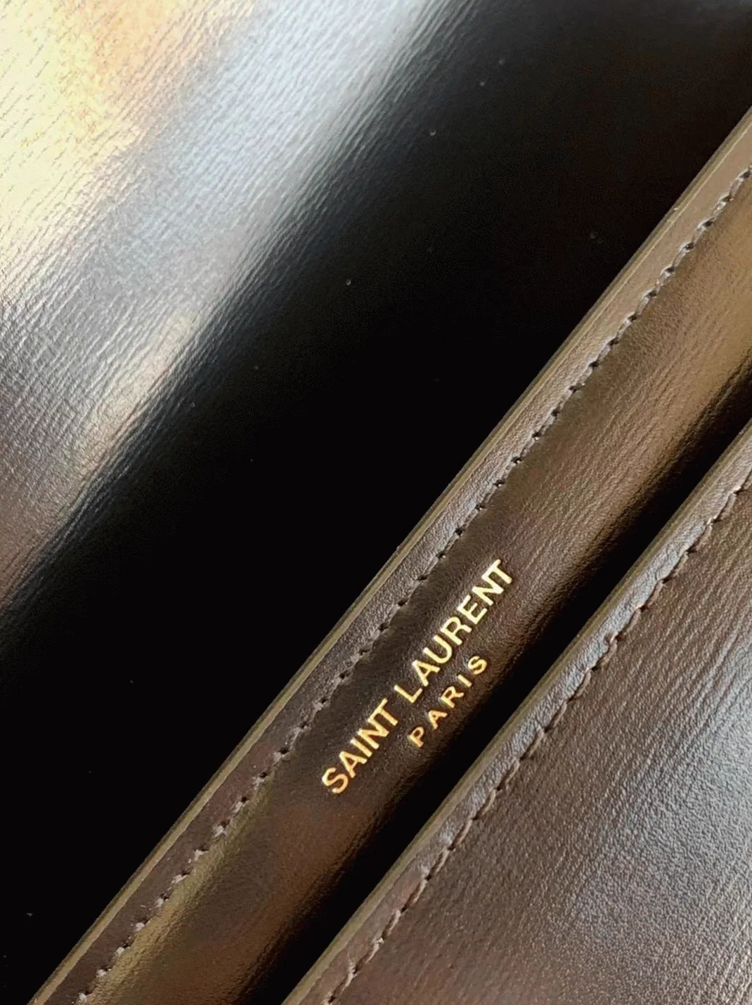 Reference image illustrating Replica Saint Laurent Sunset Medium Chain Bag in Black Calfskin – A Detailed Style Guide
