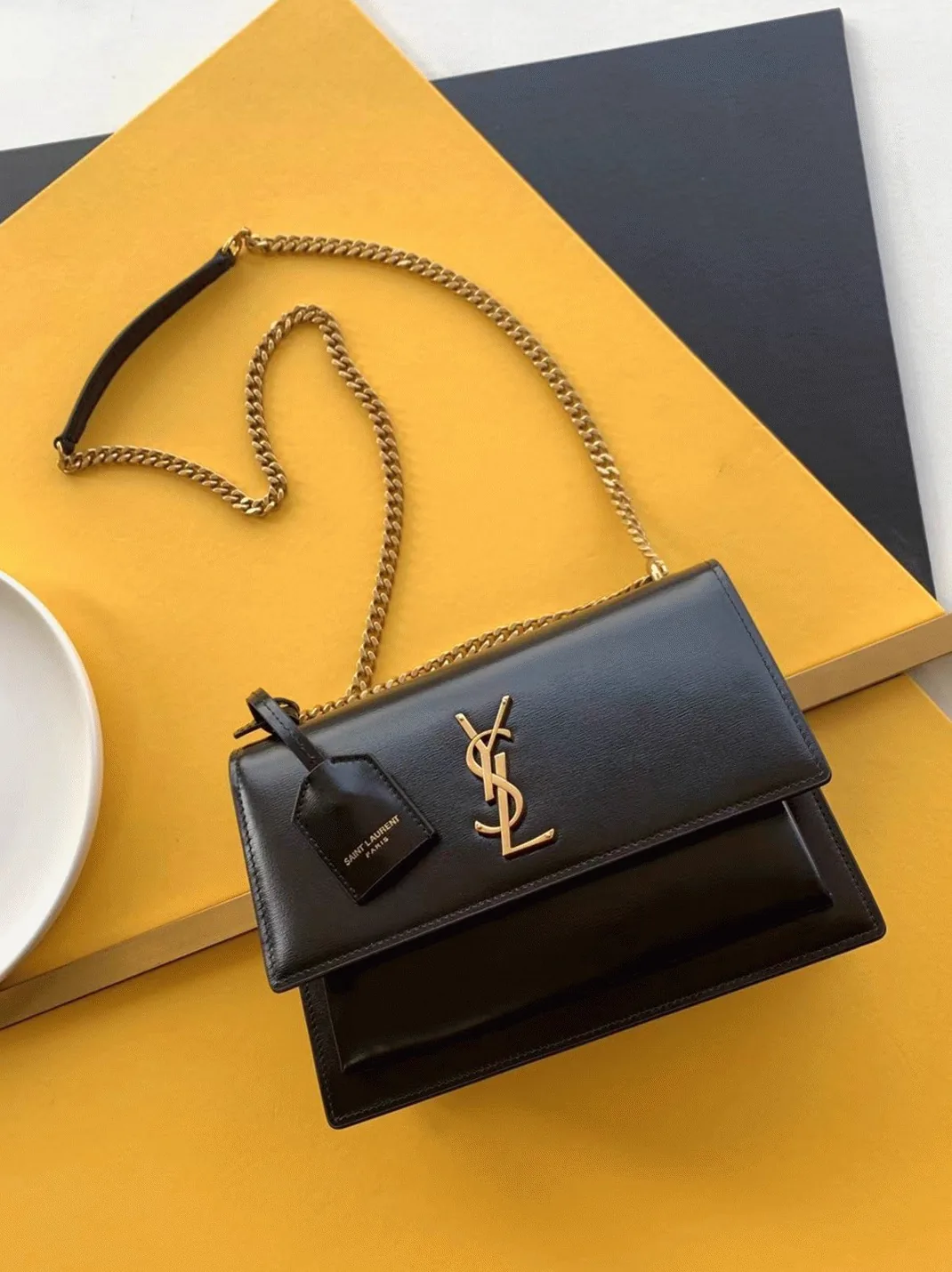 Reference image illustrating Replica Saint Laurent Sunset Medium Chain Bag in Black Calfskin – A Detailed Style Guide