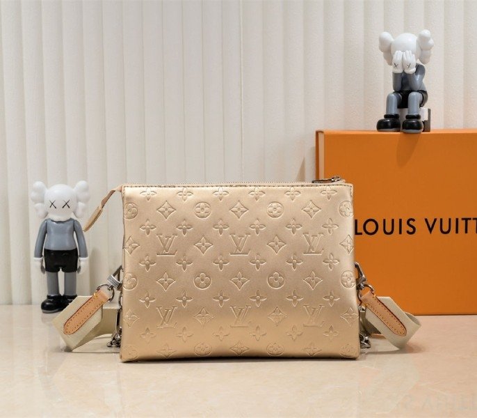 Reference image illustrating Replica Louis Vuitton Coussin PM Bag in Light Gold with Jacquard Strap