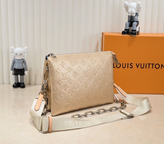 Reference image illustrating Replica Louis Vuitton Coussin PM Bag in Light Gold with Jacquard Strap