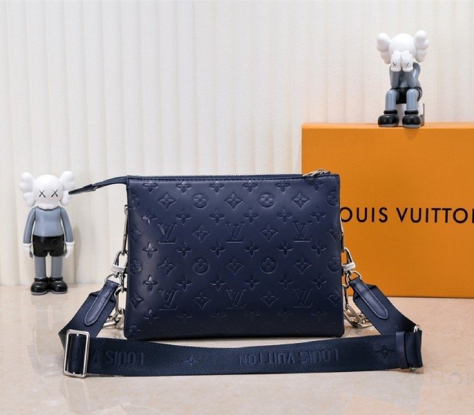 Reference image illustrating Replica Louis Vuitton Coussin PM Bag in Navy Blue with Jacquard Strap – Design & Style Guide