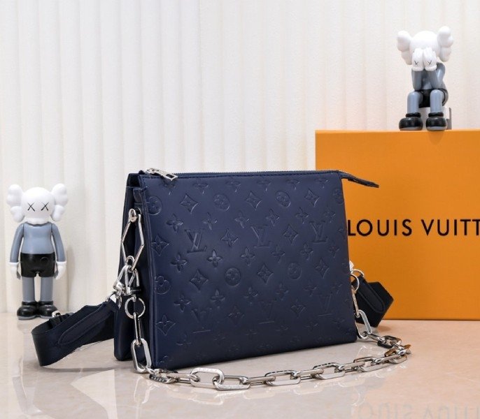Reference image illustrating Replica Louis Vuitton Coussin PM Bag in Navy Blue with Jacquard Strap – Design & Style Guide