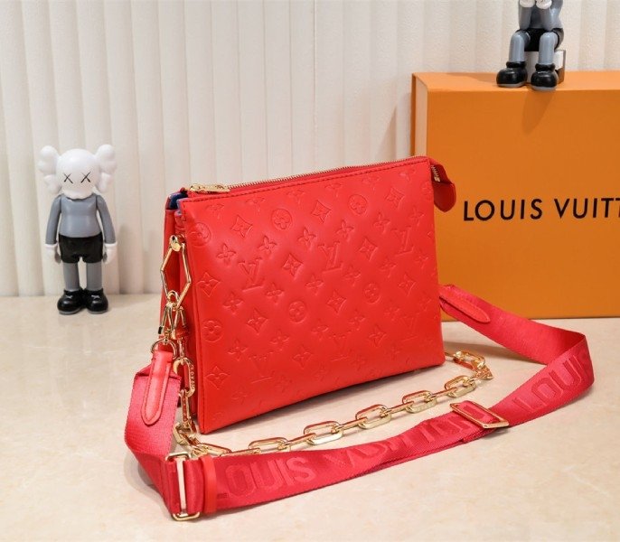 Reference image illustrating Replica Louis Vuitton Coussin PM Bag in Neon Red with Jacquard Strap