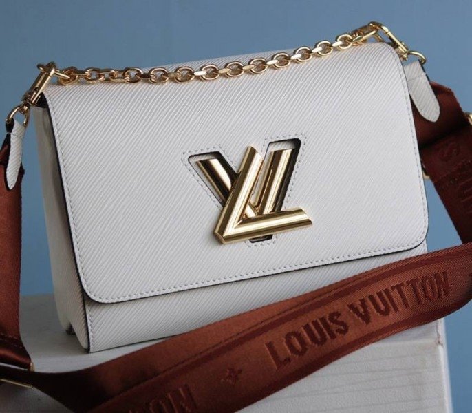 Reference image illustrating Replica Louis Vuitton Epi Leather Twist MM Bag in Optic White with Jacquard Strap