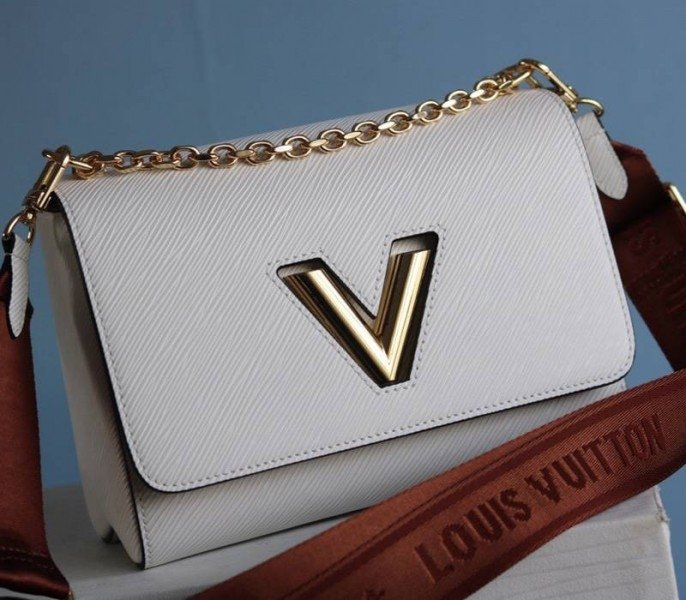 Reference image illustrating Replica Louis Vuitton Epi Leather Twist MM Bag in Optic White with Jacquard Strap