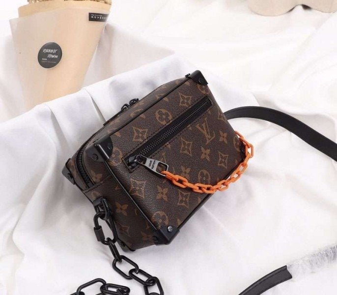 Reference image illustrating Replica Louis Vuitton Monogram Canvas Mini Soft Trunk Black Bag – Style & Design Guide