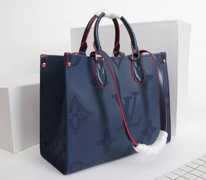 Reference image illustrating Replica Louis Vuitton Monogram Empreinte Giant Onthego MM Tote in Navy Blue – A Detailed Style Guide