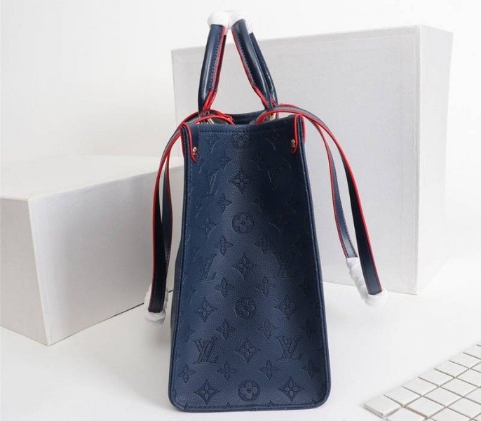 Reference image illustrating Replica Louis Vuitton Monogram Empreinte Giant Onthego MM Tote in Navy Blue – A Detailed Style Guide