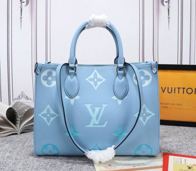 Replica Louis Vuitton Monogram Empreinte Onthego MM Bag in Summer Blue – Design & Style Guide cover image