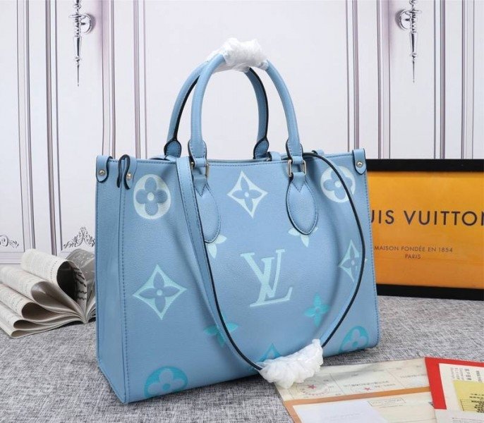 Reference image illustrating Replica Louis Vuitton Monogram Empreinte Onthego MM Bag in Summer Blue – Design & Style Guide
