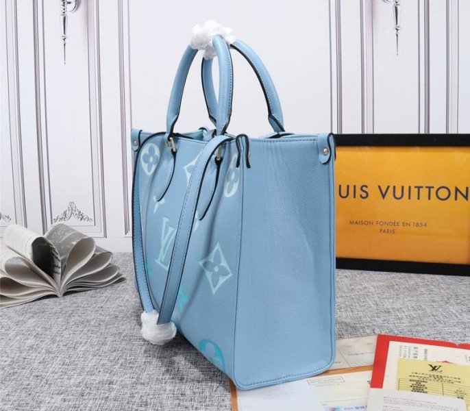 Reference image illustrating Replica Louis Vuitton Monogram Empreinte Onthego MM Bag in Summer Blue – Design & Style Guide