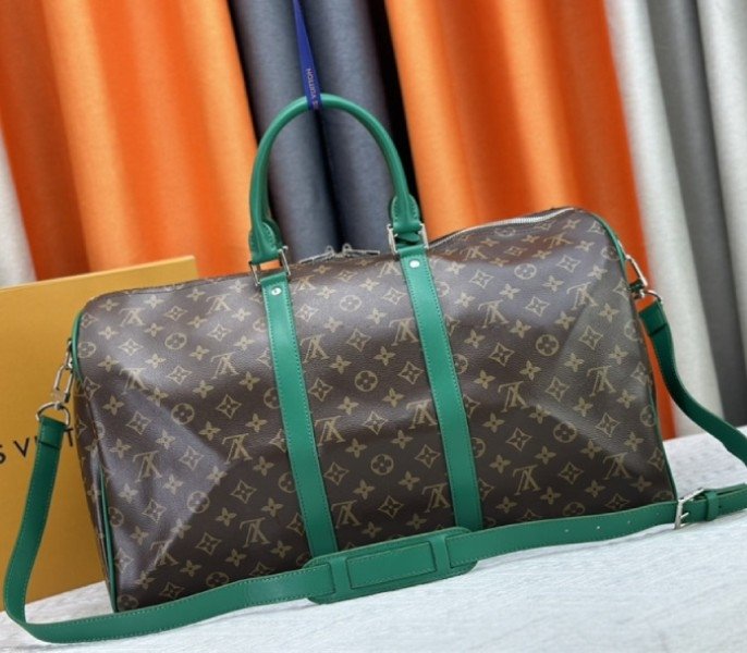Reference image illustrating Replica Louis Vuitton Monogram Macassar Canvas Keepall Bandouliere 50 in Borneo Green