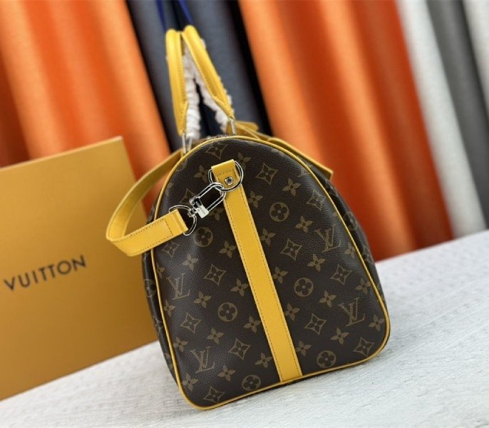Reference image illustrating Replica Louis Vuitton Monogram Macassar Canvas Keepall Bandouliere 50 in Safran Yellow