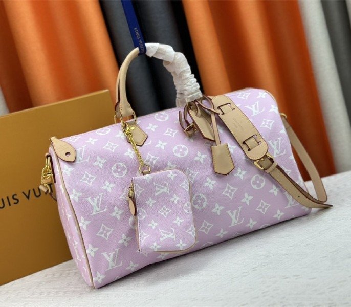 Reference image illustrating Replica Louis Vuitton Speedy P9 Bandouliere 40 Bag in Hot Pink – Design, History & Styling Guide