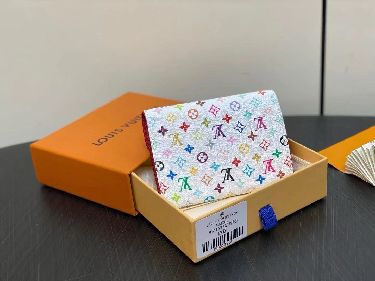 Reference image illustrating Replica Louis Vuitton x Takashi Murakami Victorine Wallet – Multicolor Monogram Compact Design