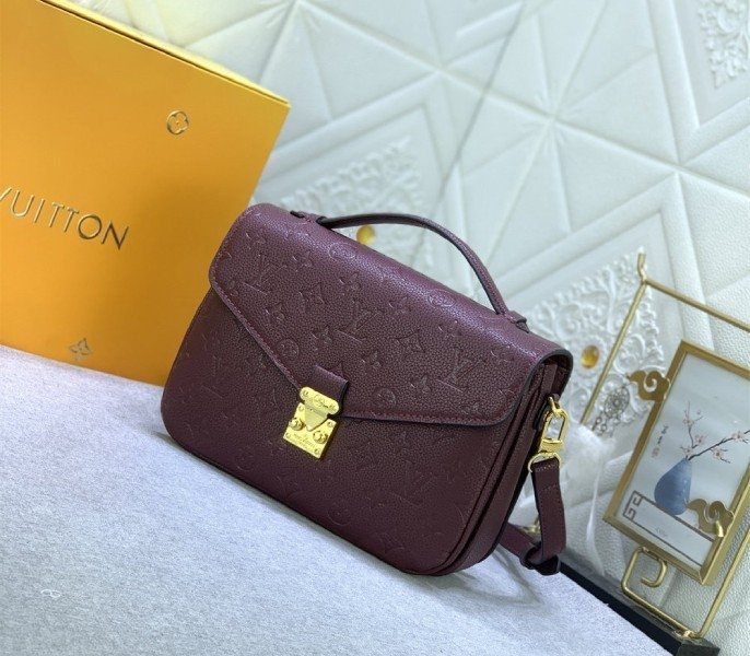Reference image illustrating Replica LV Monogram Empreinte Leather Métis Hobo Bag in Wine