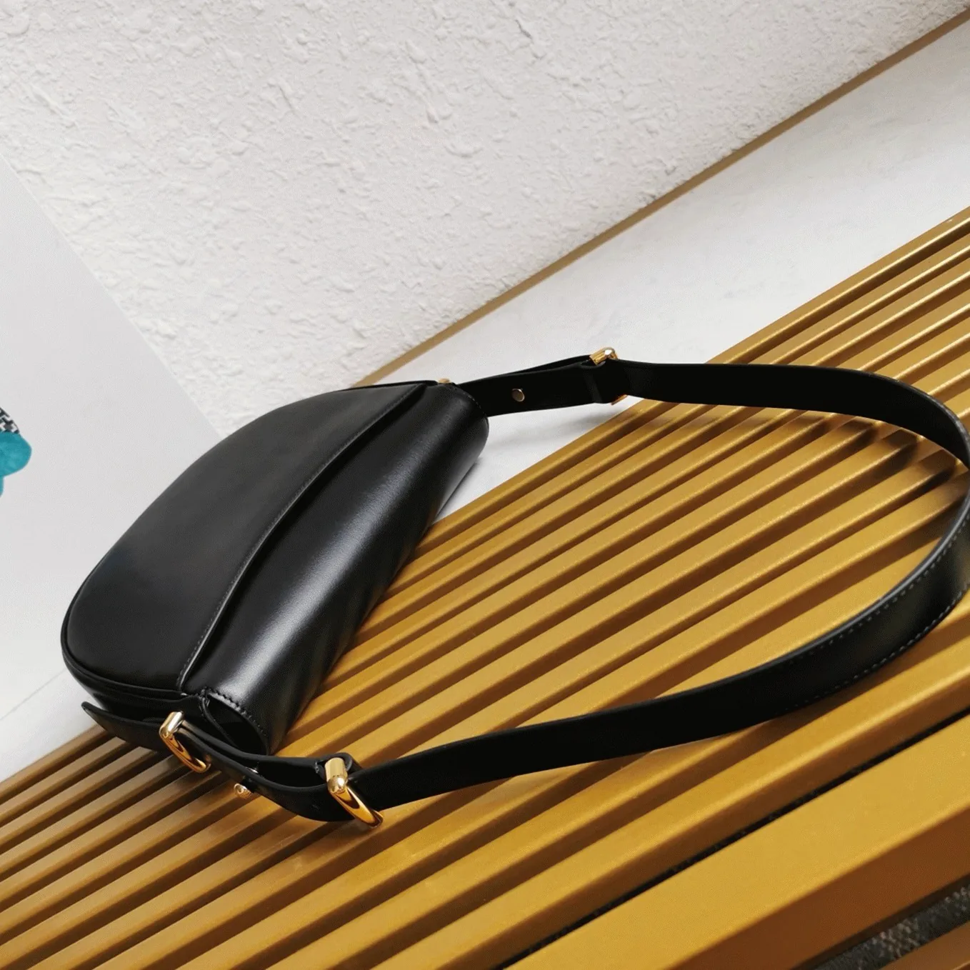 Reference image illustrating Replica Prada Arque Shoulder Bag with Flap in Black – Design, History & Styling Guide
