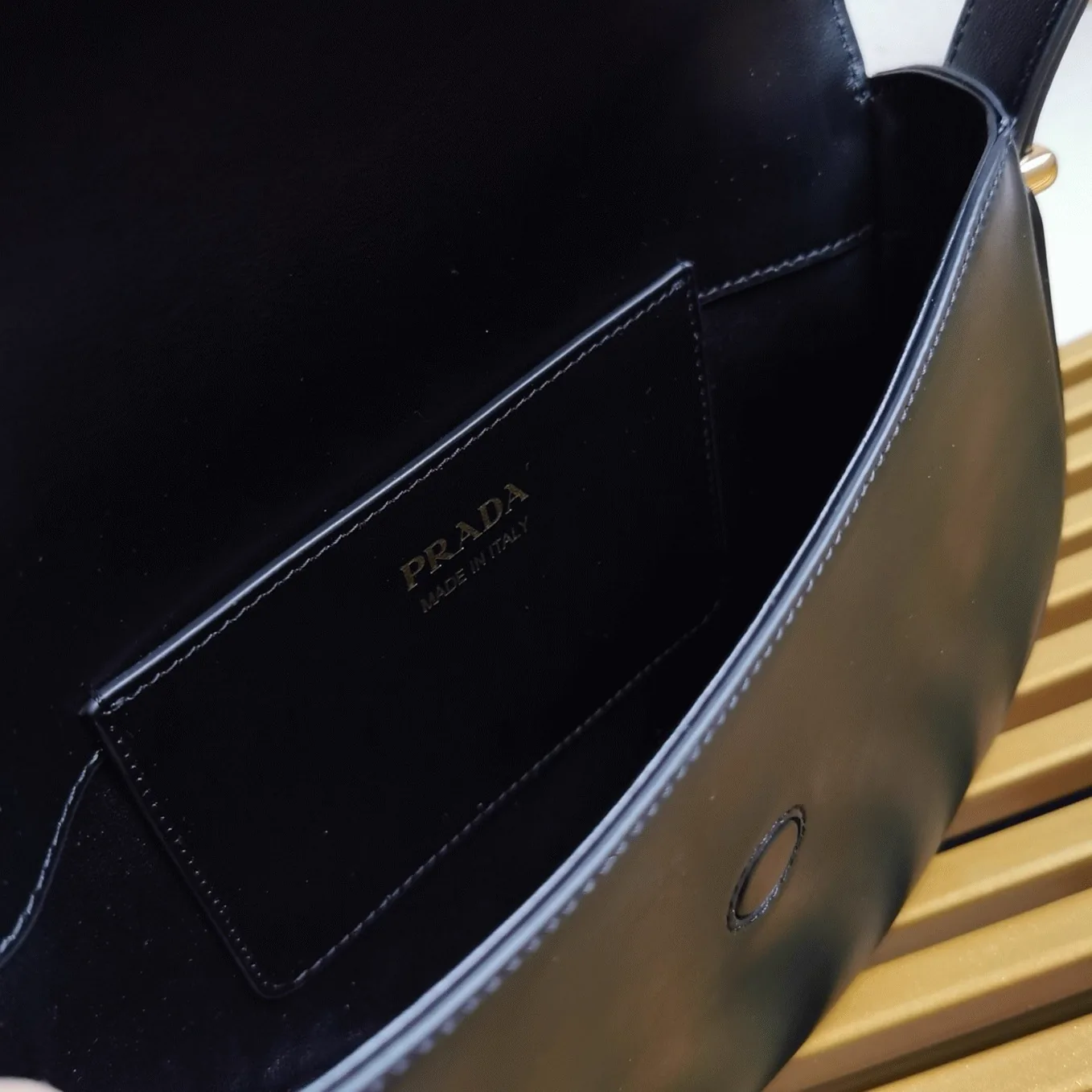 Reference image illustrating Replica Prada Arque Shoulder Bag with Flap in Black – Design, History & Styling Guide