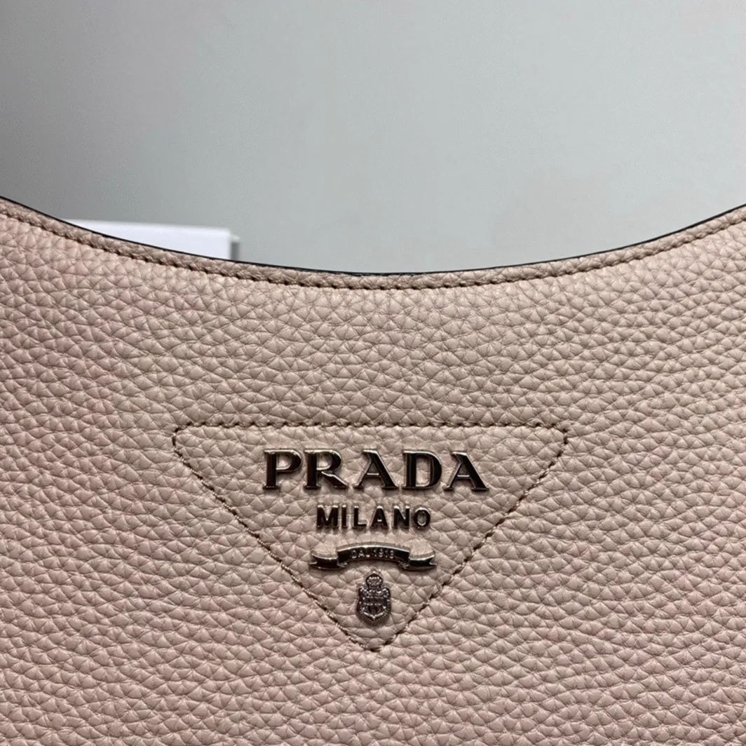 Reference image illustrating Replica Prada Re-Edition 2005 Hobo Bag in Sand – A Detailed Style Guide