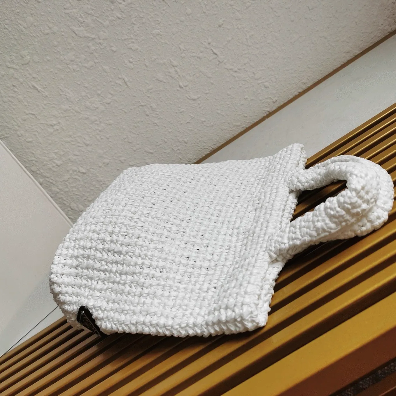 Reference image illustrating Replica Prada Crochet Tote Bag in White Raffia-Effect Yarn – A Detailed Style Guide