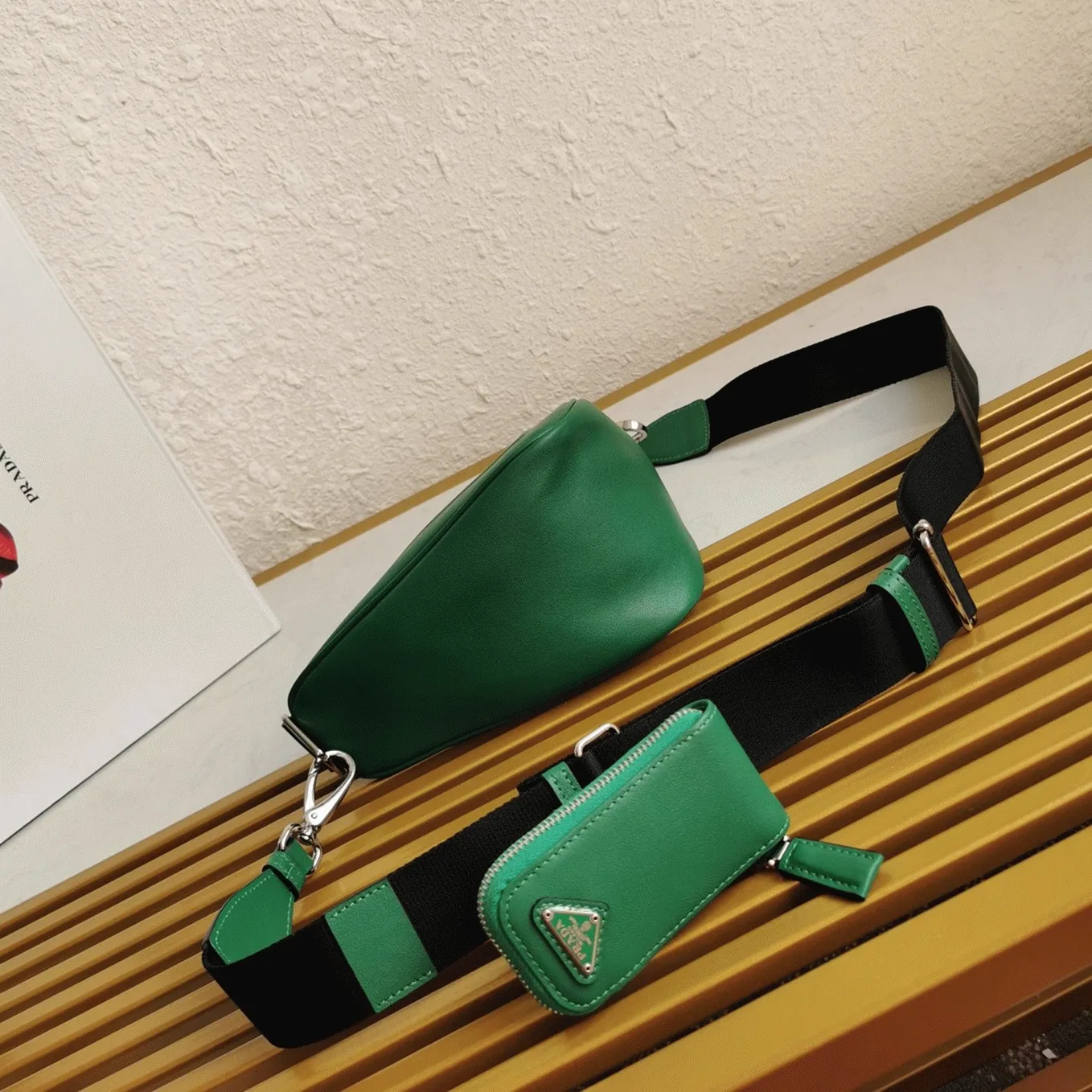 Reference image illustrating Replica Prada Triangle Shoulder Bag in Green – Design, History & Styling Guide