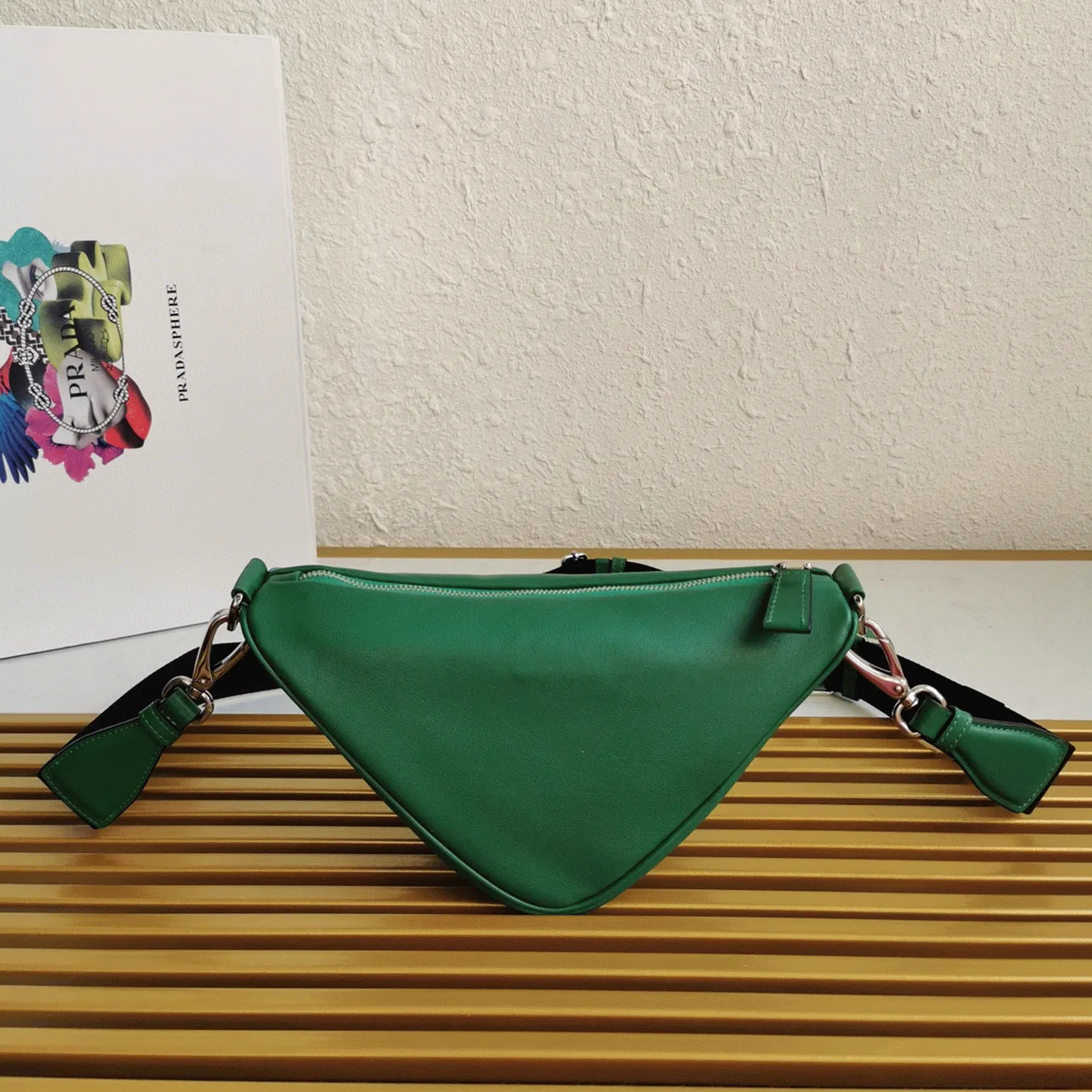 Reference image illustrating Replica Prada Triangle Shoulder Bag in Green – Design, History & Styling Guide