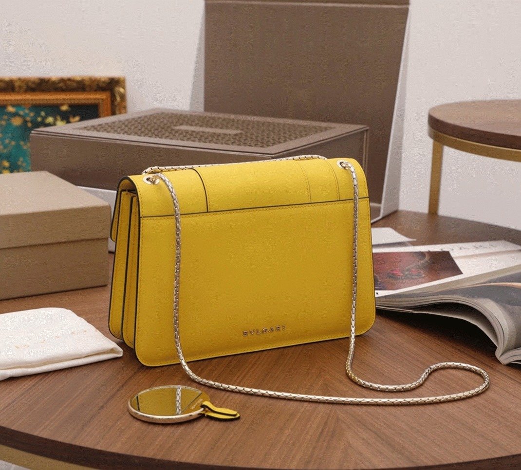 Reference image illustrating Replica Bvlgari Serpenti Forever Medium Shoulder Bag in Yellow Calfskin – Design, History & Styling Guide