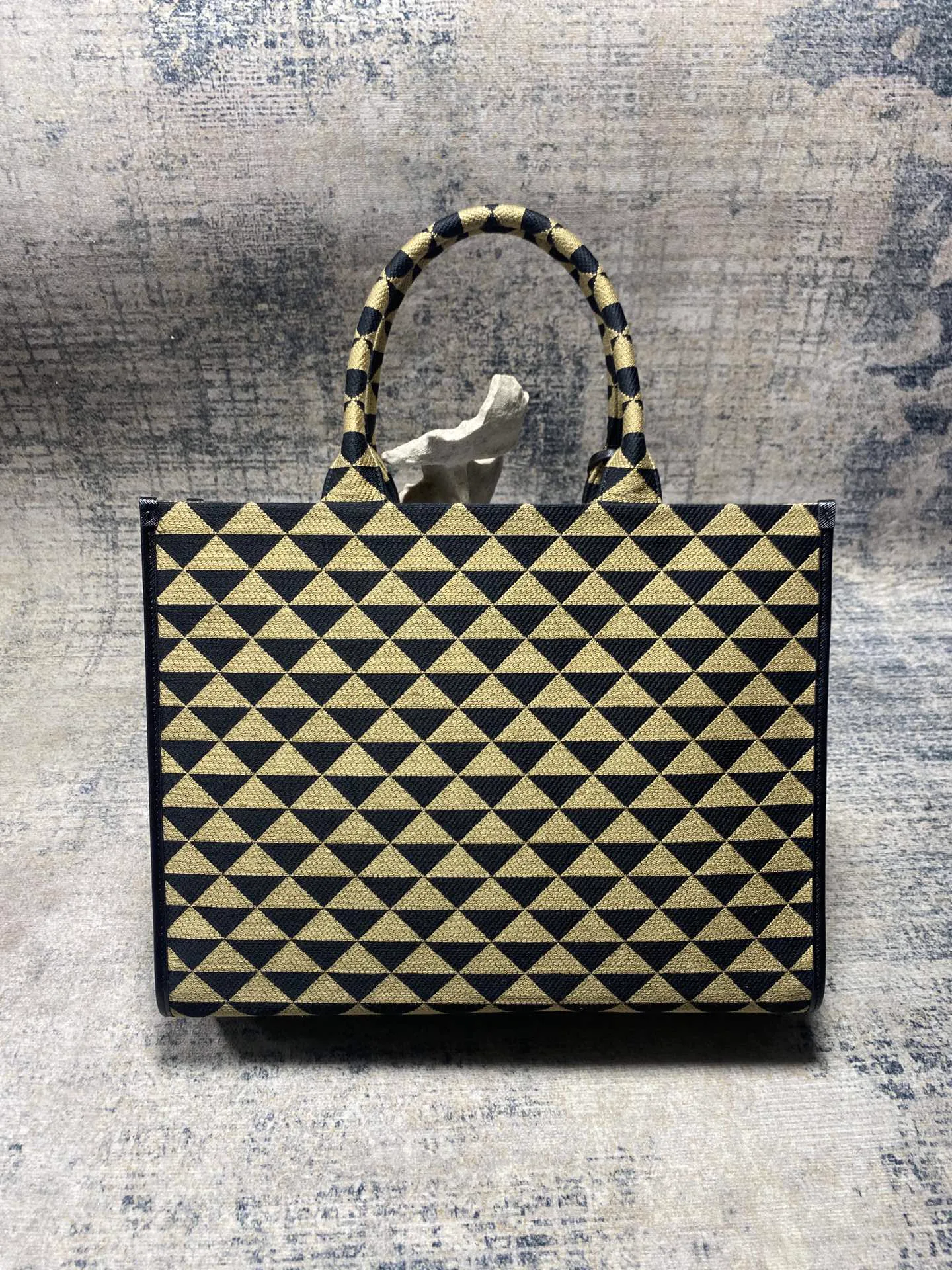 Reference image illustrating Replica Symbole Bucket Bag: A Detailed Look at the Prada-Inspired Design