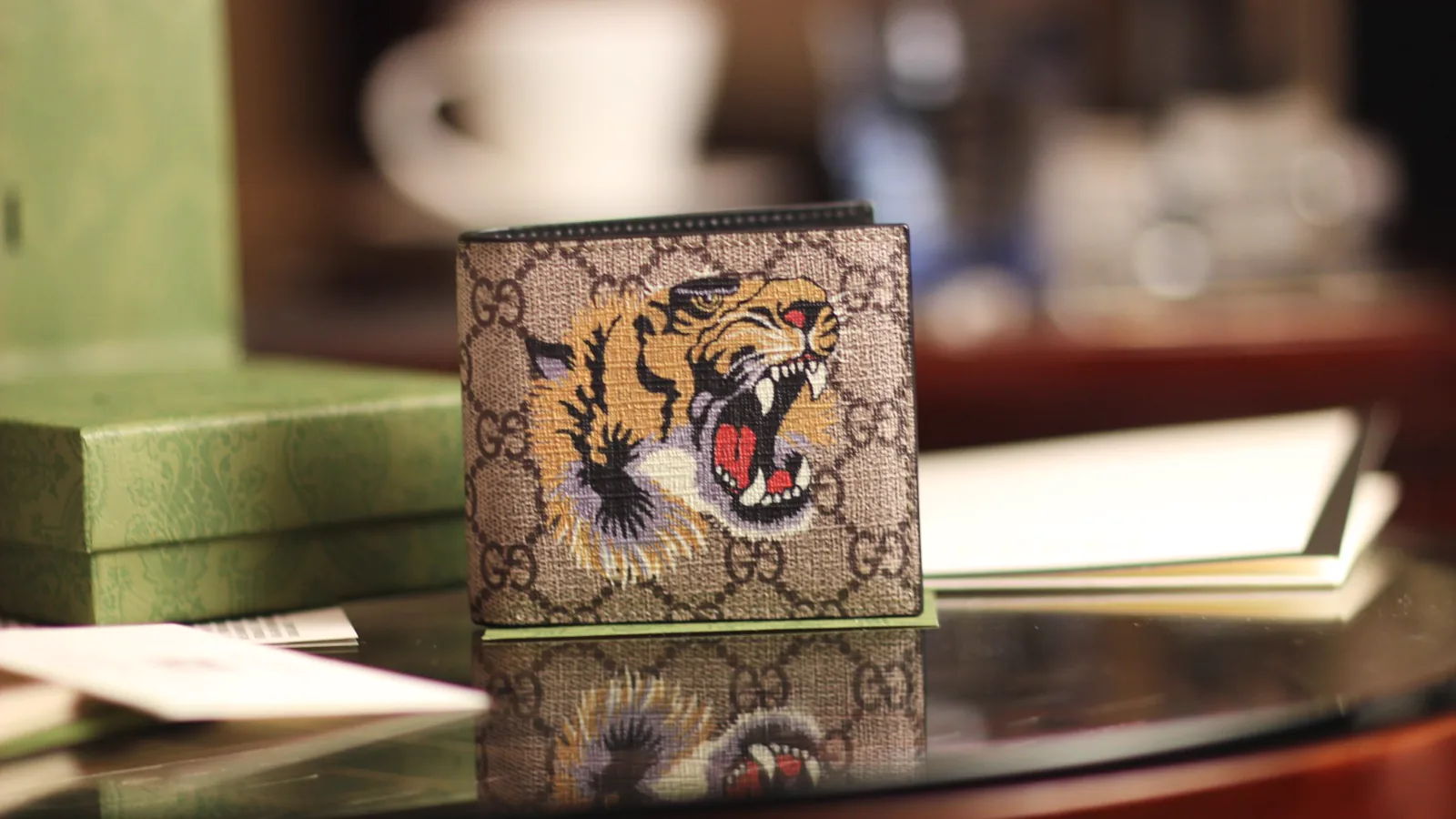 Reference image illustrating Replica Gucci Tiger Print GG Supreme Wallet – Iconic Animalier Design