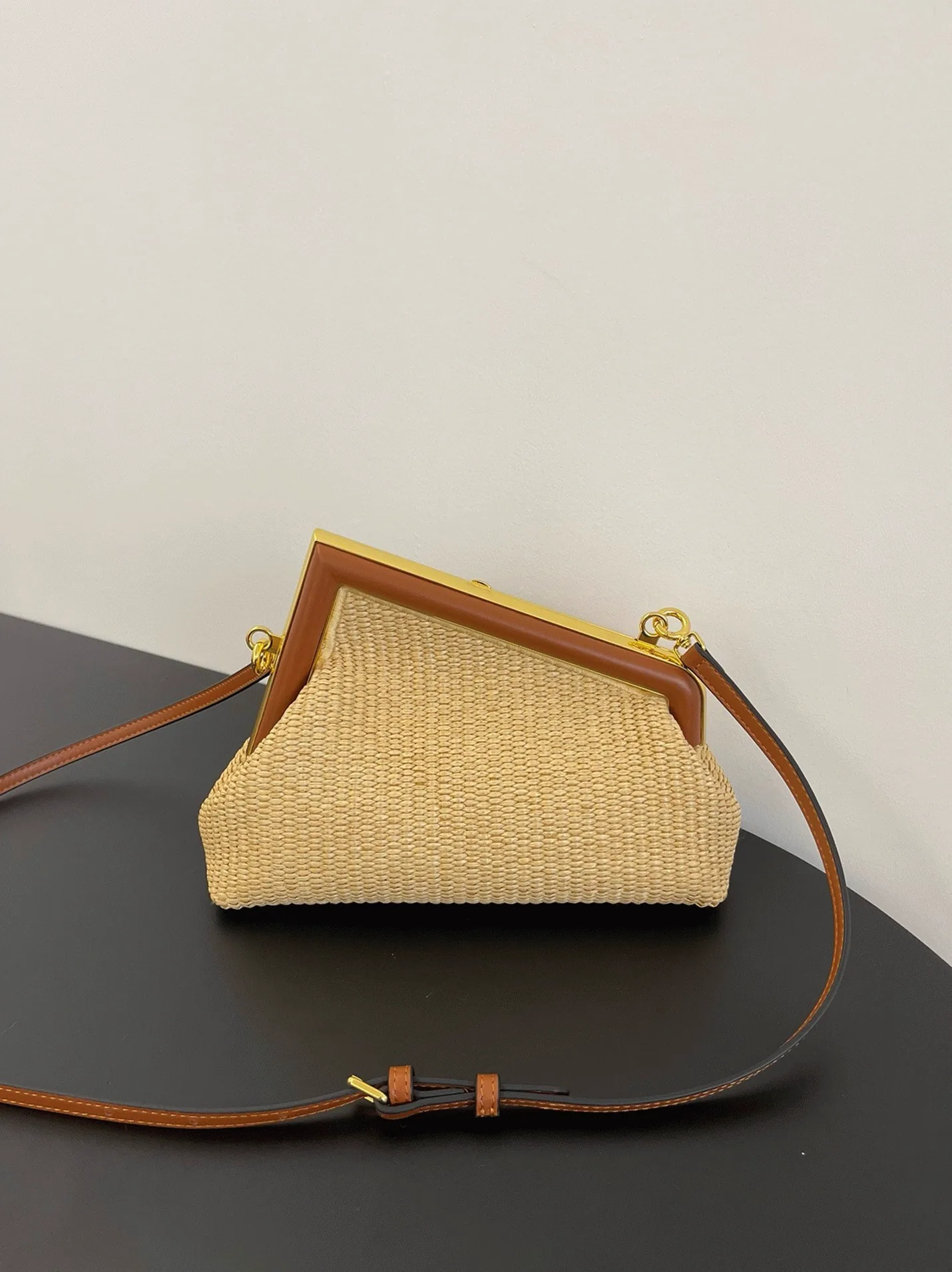 Reference image illustrating Replica Fendi First Small Bag in Natural Raffia Straw – A Detailed Style Guide