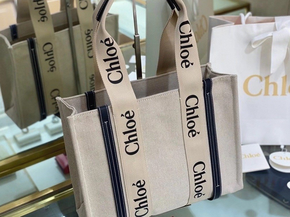 Reference image illustrating Replica Chloe Medium Woody Tote Bag in Canvas with Blue Leather Strips