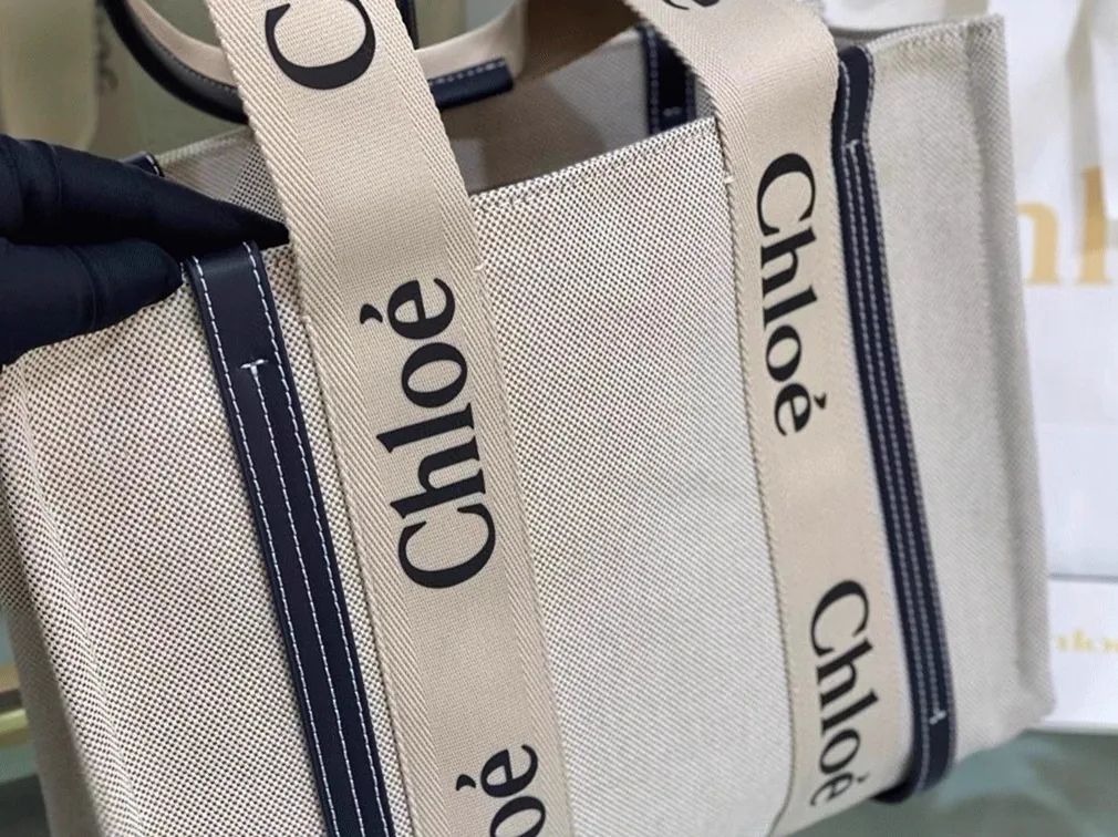 Reference image illustrating Replica Chloe Medium Woody Tote Bag in Canvas with Blue Leather Strips