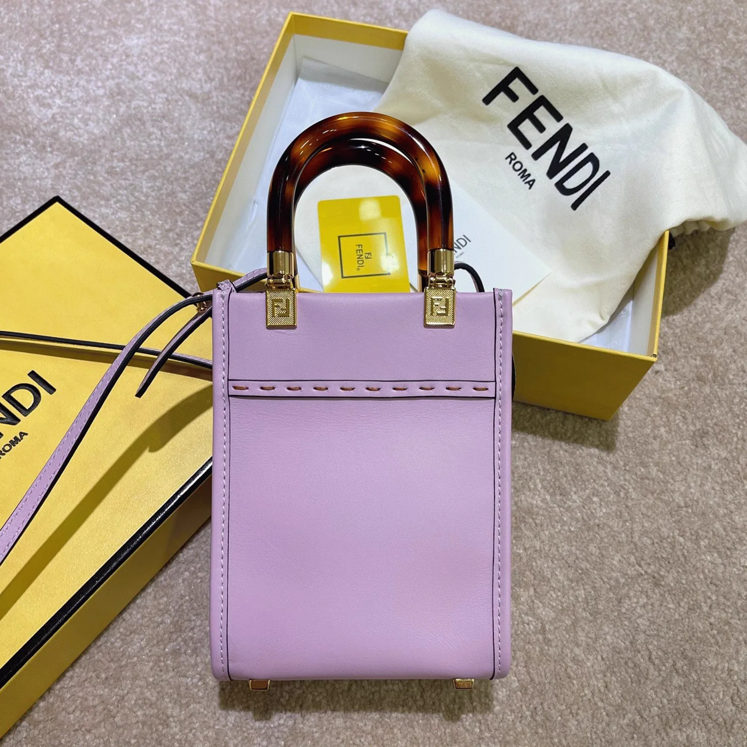 Reference image illustrating Replica Fendi Mini Sunshine Shopper Bag in Lilas Leather – Style & Design Guide