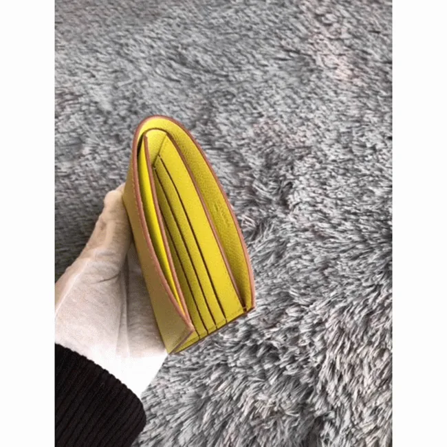 Reference image illustrating Replica Hermès Copernic Compact Wallet in Yellow – A Detailed Style Guide