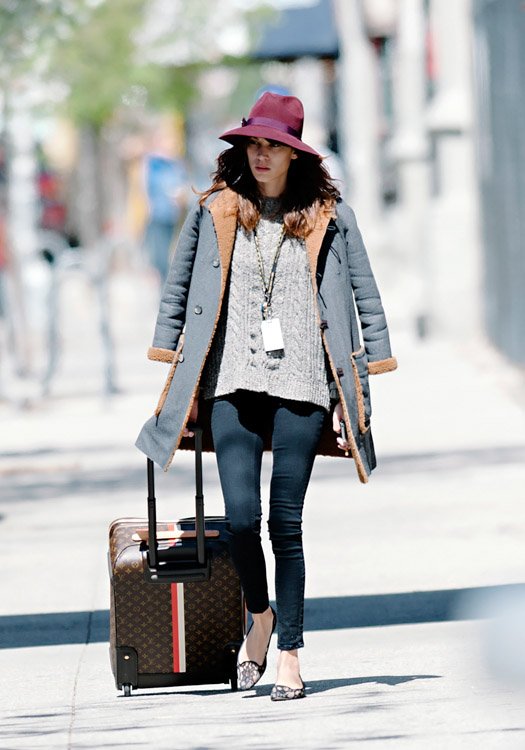 Reference image illustrating Alexa Chung Spotted Wheeling a Custom Louis Vuitton Mon Monogram Pegase Suitcase Through NYC