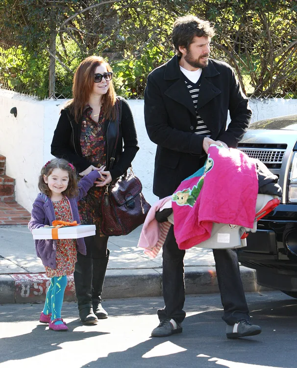 Reference image illustrating Alyson Hannigan’s Prada Madras Satchel: A Casual Family Outing in Venice Beach