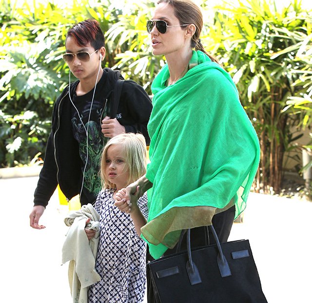 Reference image illustrating Angelina Jolie’s Go-To Travel Bag: The Saint Laurent Sac de Jour Suede Tote